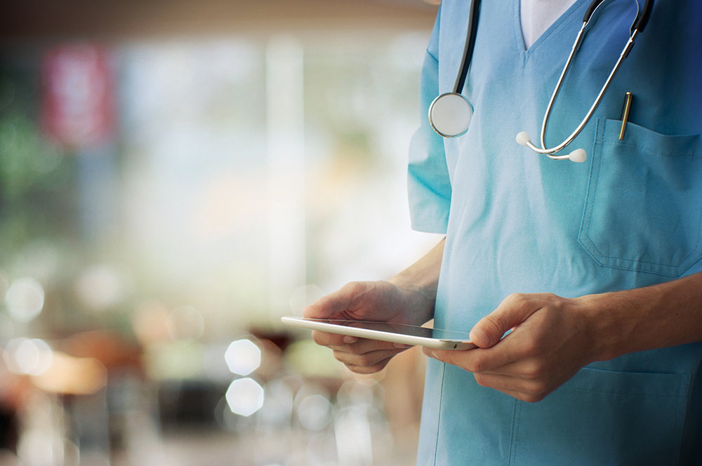 Doctor Working on a Tablet