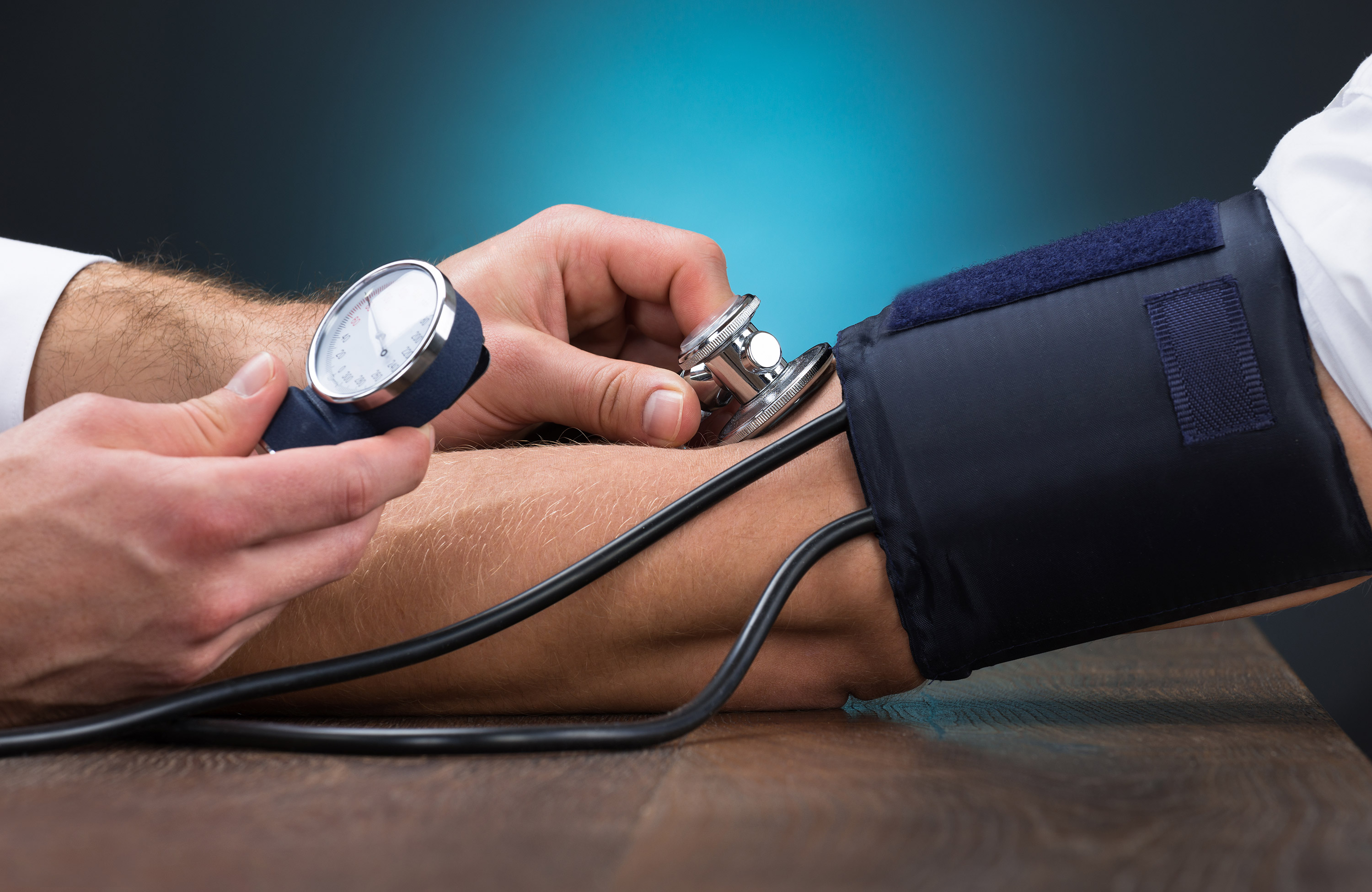 healthcare translation Healthcare Professional Taking Blood Pressure Reading