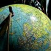 globe featuring countries where the most common languages are spoken